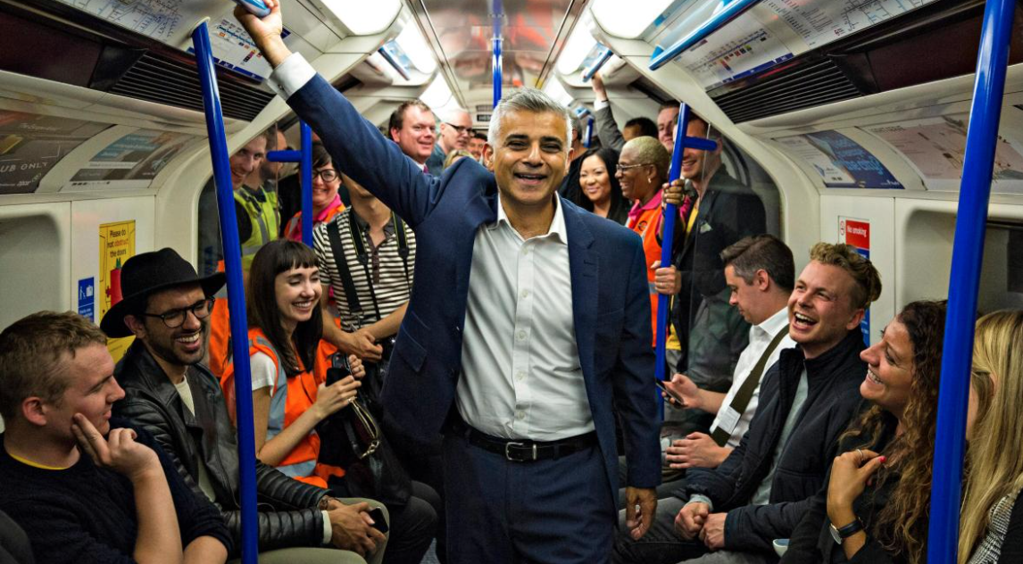 The picture shows Sadiq Khan on a crowded subway.