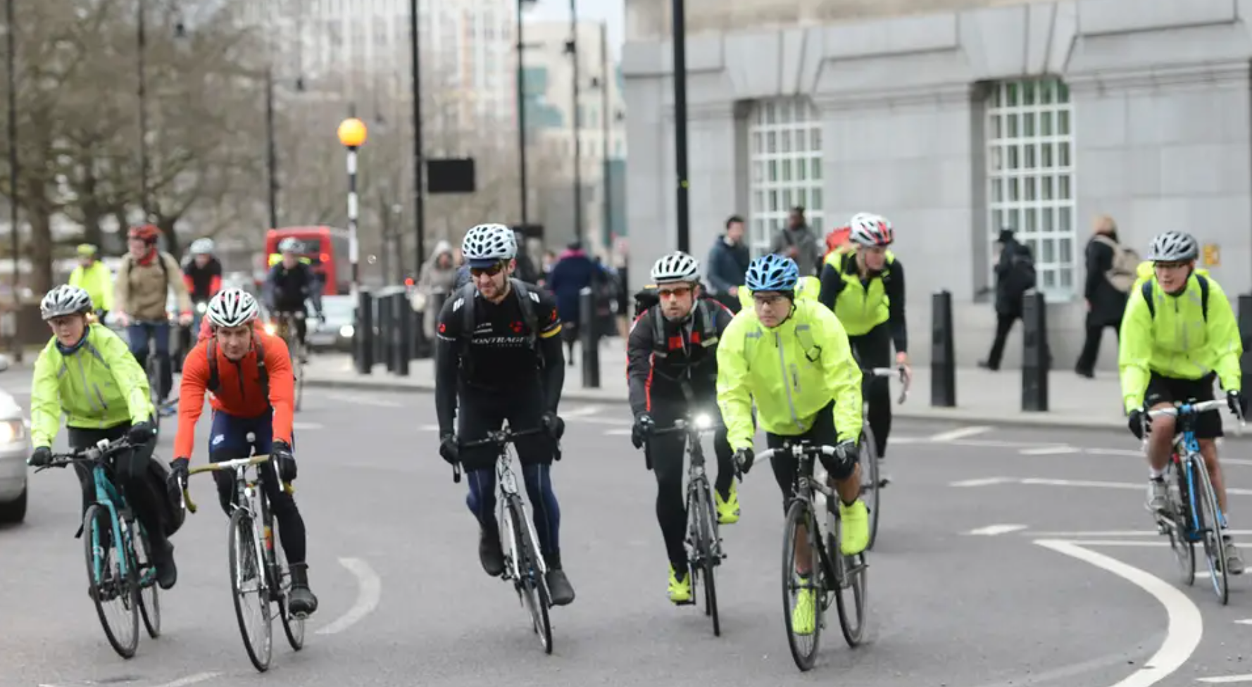The picture shows a group of white, male cyclists in London.